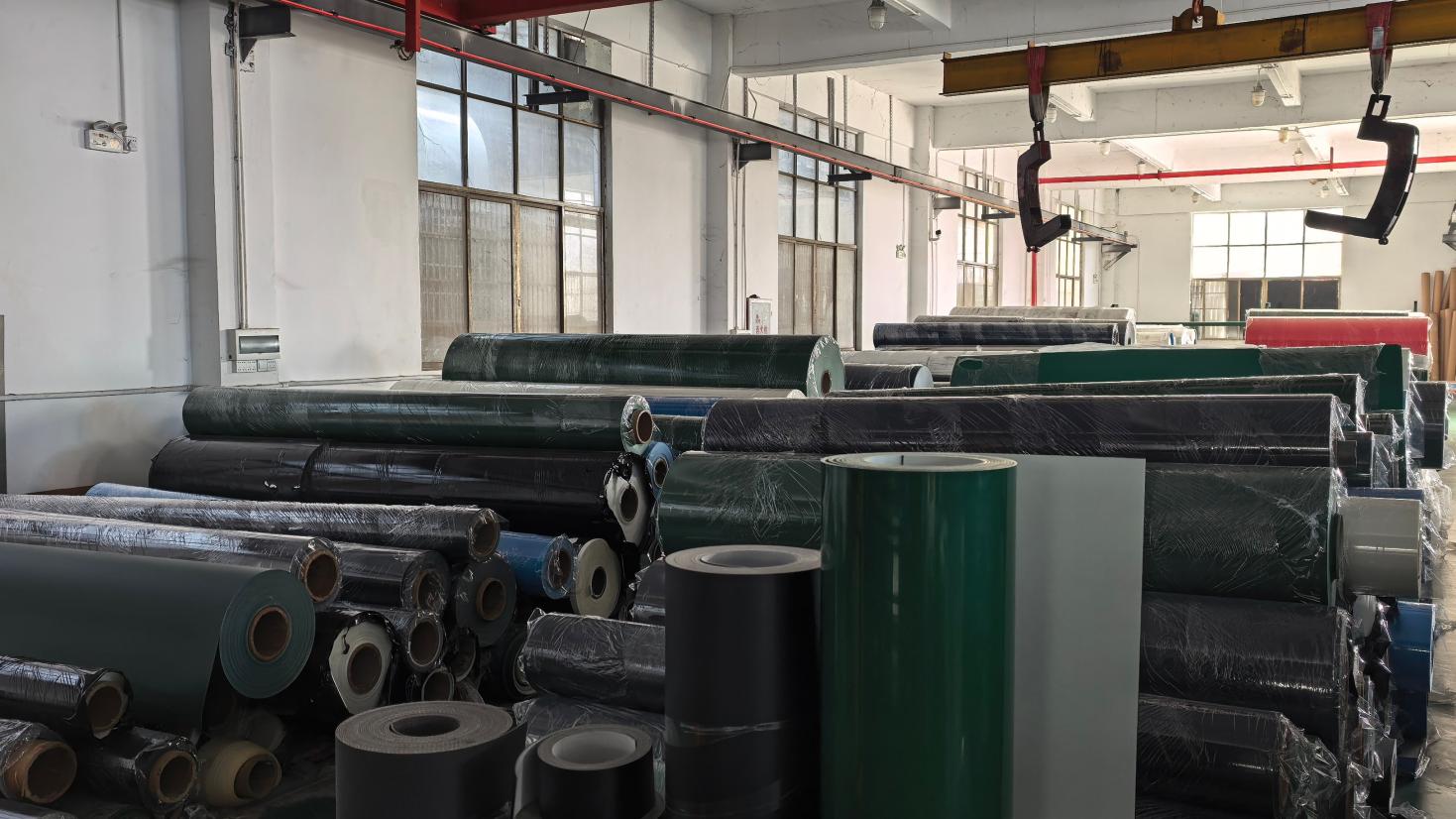 Industrial belt rolls stored in the Libo warehouse