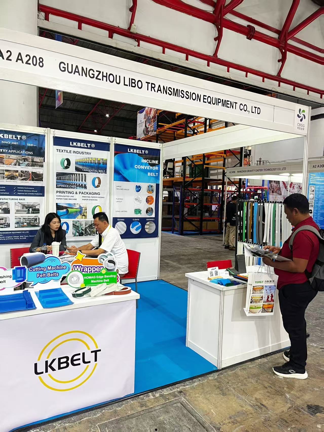 Visitors and belt samples at the LKBELT booth at International Industrial Week Indonesia 2026