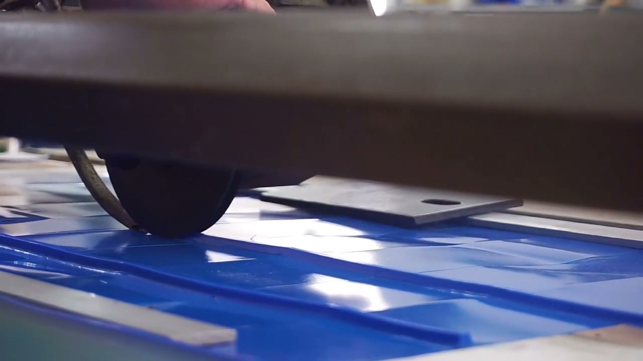 Blue belt material cut on workshop equipment